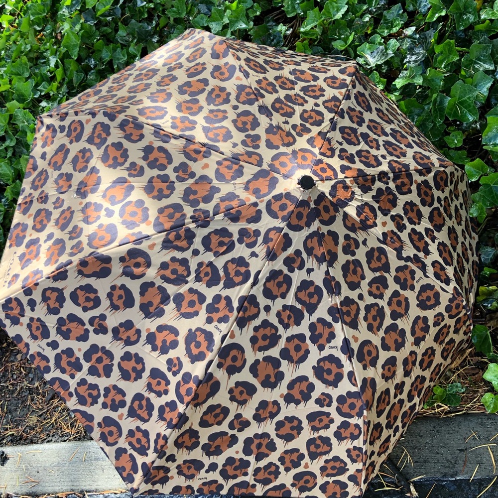 Brand new Coach folding umbrella